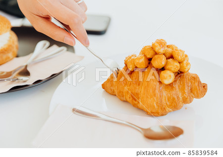 Croissant with Macadamia topping luxury bakery looking tasty delicious 85839584