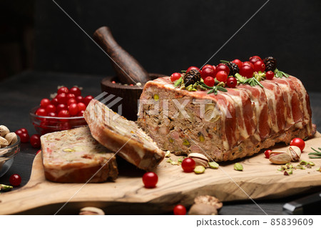 Traditional French terrine covered with bacon on dark wooden background 85839609
