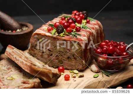 Traditional French terrine covered with bacon on dark wooden background 85839626