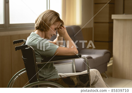 adult women patient feel sad lonely sitting on wheelchair at hospital homecare dim light adult women patient feel sad lonely sitting on wheelchair at hospital homecare dim light 85839710