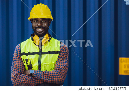 Portrait Black African staff worker happy smile working in cargo shipping logistic port. Portrait Black African staff worker happy smile working in cargo shipping logistic port. 85839755