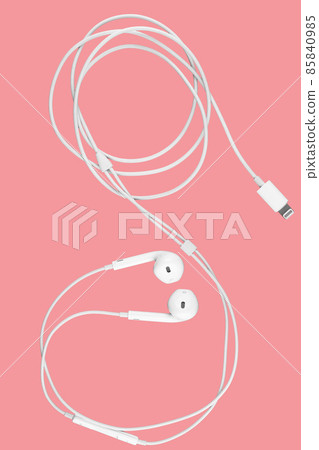earphones on pink background. 85840985