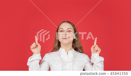kid in white shirt raised fingers up on red background. childhood. cheerful child portrait. kid in white shirt raised fingers up on red background. childhood. cheerful child portrait. 85841350