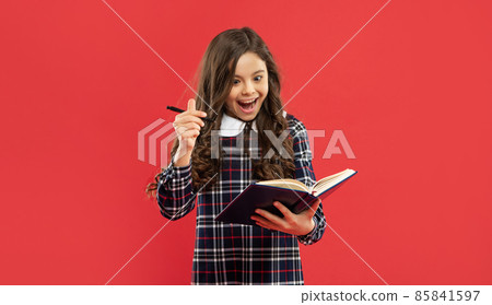 amazed child holding copybooks. concept of knowledge and wisdom. back to school. amazed child holding copybooks. concept of knowledge and wisdom. back to school. 85841597