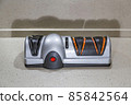 Modern electric knife sharpener in the home kitchen 85842564