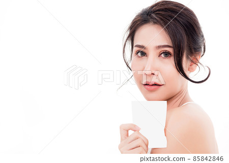 woman smiling she's holding blank square skin care woman smiling she's holding blank square skin care 85842846
