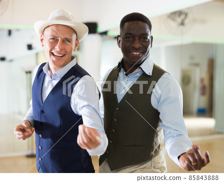 Two men dancing jazz in studio Two men dancing jazz in studio 85843888
