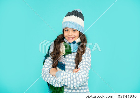 portrait of child wearing warm clothes. express positive emotion. winter fashion 85844936