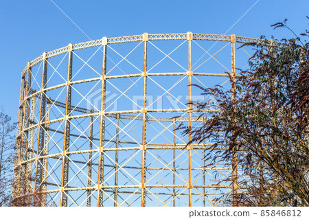 Disused Bradford Road gas holder seen from the Ashton Canal, Manchester, UK. 85846812