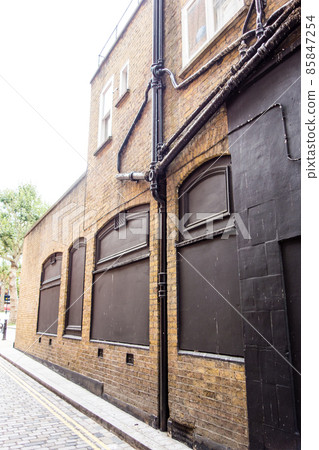 Richmond cityscape on the outskirts of London, a historic brick building with blindfolded windows Richmond cityscape on the outskirts of London, a historic brick building with blindfolded windows 85847254