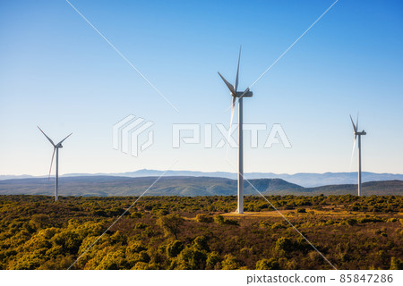Turbines in a mountain wind farm. Ecological energy production. 85847286