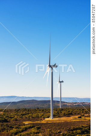 Turbines in a mountain wind farm. Ecological energy production. 85847287