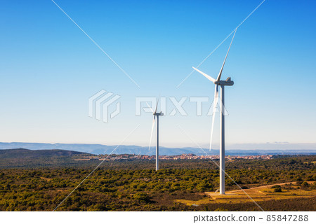 Turbines in a mountain wind farm. Ecological energy production. 85847288