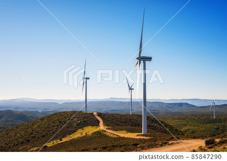 Turbines in a mountain wind farm. Ecological energy production. 85847290
