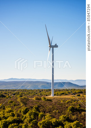 Turbines in a mountain wind farm. Ecological energy production. 85847294