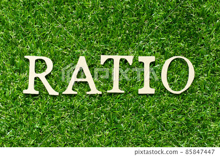 Wood letter in word ratio on green grass background Wood letter in word ratio on green grass background 85847447