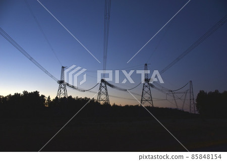 High voltage power line in the evening in the forest 85848154