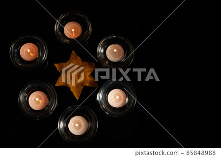 Burning candle on black background. Holocaust memory day 85848988