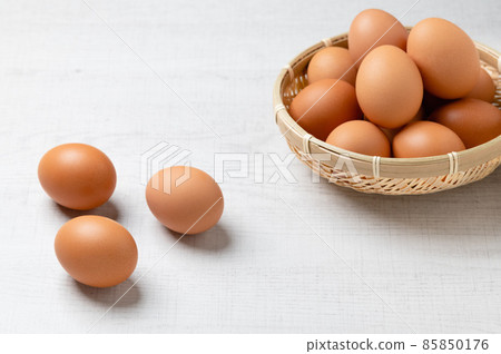 Red egg in a bamboo colander Red egg in a bamboo colander 85850176