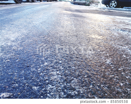 asphalt road covered with ice, slippery road winter asphalt road covered with ice, slippery road winter 85850538