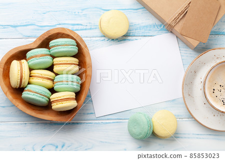 Homemade macaroons in gift box and coffee 85853023