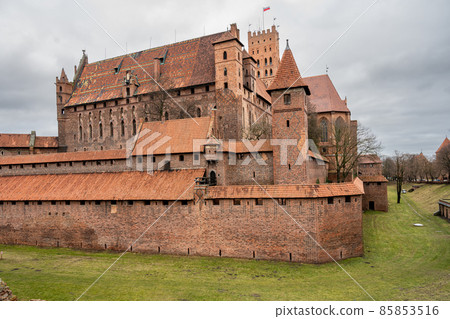 The Castle of the Teutonic Order in Malbork in the Pomerania region, Poland. This is the largest castle in the world measured by land area and a UNESCO World Heritage Site The Castle of the Teutonic Order in Malbork in the Pomerania region, Poland. This is the largest castle in the world measured by land area and a UNESCO World Heritage Site 85853516