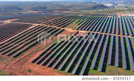 Aerial view of field with photovoltaic solar panels eco friendly renewable energy concept. Aerial view of field with photovoltaic solar panels eco friendly renewable energy concept. 85854317