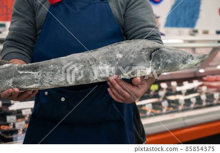 Male fishmonger or fish market worker 85854375