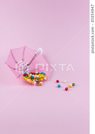 Upturned umbrella with caramel candy. Concept for Dia de Reyes Magos day (Three Wise Men) or Epiphany day.  85854947