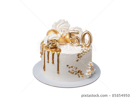 A delightful decorated white and gold cream cake for a fiftieth anniversary. On a white background close-up. A delightful decorated white and gold cream cake for a fiftieth anniversary. On a white background close-up. 85854950