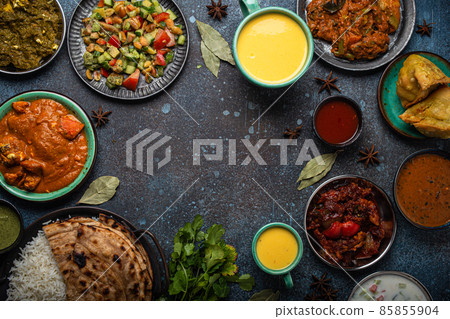 Indian ethnic food buffet on concrete table from above copy space Indian ethnic food buffet on concrete table from above copy space 85855904