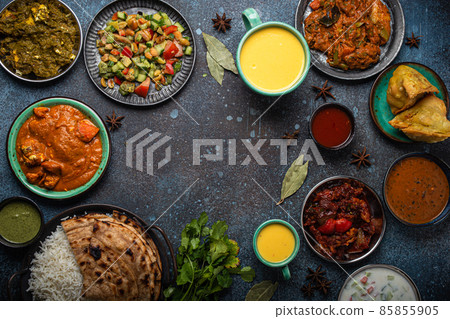 Indian ethnic food buffet on concrete table from above copy space Indian ethnic food buffet on concrete table from above copy space 85855905