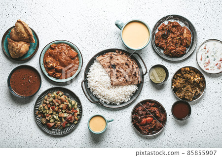 Indian ethnic food buffet on white concrete table from above 85855907