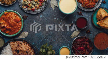 Indian ethnic food buffet on concrete table from above copy space Indian ethnic food buffet on concrete table from above copy space 85855917