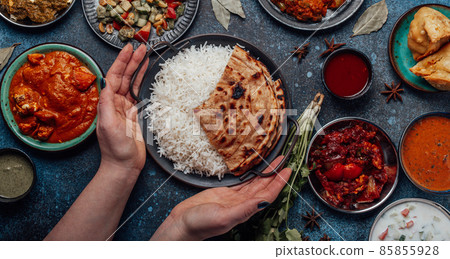 Assorted Indian ethnic food buffet on rustic concrete table from above Assorted Indian ethnic food buffet on rustic concrete table from above 85855928