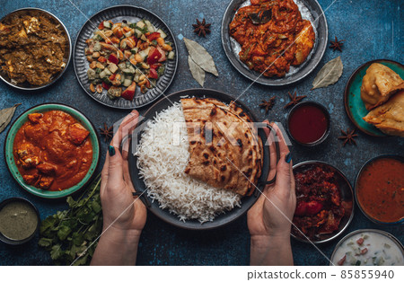 Assorted Indian ethnic food buffet on rustic concrete table from above Assorted Indian ethnic food buffet on rustic concrete table from above 85855940