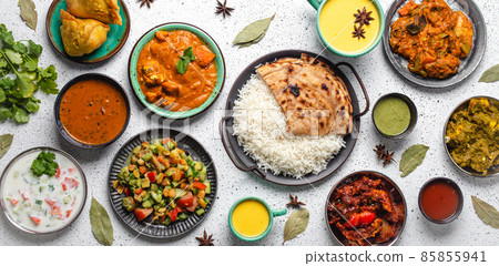 Indian ethnic food buffet on white concrete table from above Indian ethnic food buffet on white concrete table from above 85855941