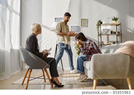 Couple arguing each other on therapy session Couple arguing each other on therapy session 85855961