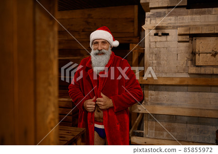 Santa Claus wrapped in bathrobe feeling cold 85855972