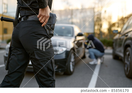 Police officer wants to arrest car thief Police officer wants to arrest car thief 85856170