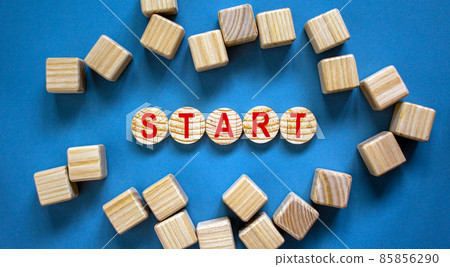 Concept word 'start' on wooden circles on a beautiful blue background. Business concept. 85856290