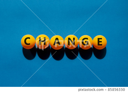 Change and business symbol. The concept word 'change' on orange table tennis balls on a beautiful blue background. Business and change concept. Change and business symbol. The concept word 'change' on orange table tennis balls on a beautiful blue background. Business and change concept. 85856330