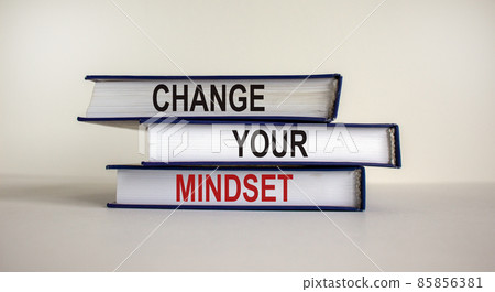 Books with text 'change your mindset' on beautiful white background. Business concept. Copy space. Books with text 'change your mindset' on beautiful white background. Business concept. Copy space. 85856381
