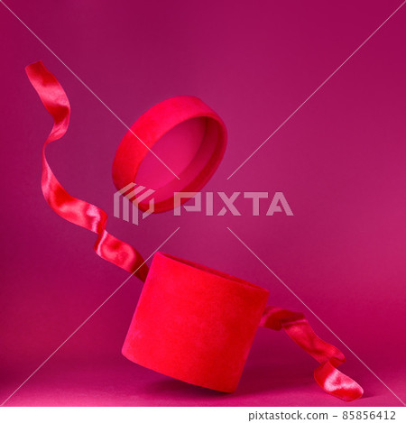 Flying red velvet gift box with red silk ribbon, valentines day, copy space, square 85856412