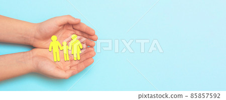 Family insurance concept with paper craft on hands Family insurance concept with paper craft on hands 85857592