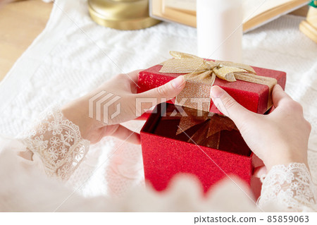 Woman opening gift box. Saint Valentine day.  85859063