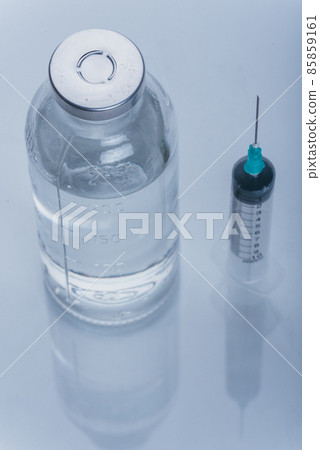 Medicine, Injection, vaccine and disposable syringe, drug concept. Sterile vial medical syringe needle. Glass medical ampoule vial for injection. 85859161