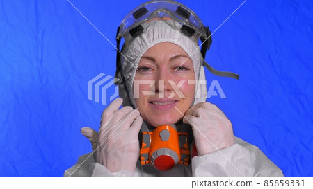 Scientist virologist in respirator. Woman close up look, wearing protective medical mask. Concept health safety N1H1 coronavirus epidemic 2019 nCoV. Scientist virologist in respirator. Woman close up look, wearing protective medical mask. Concept health safety N1H1 coronavirus epidemic 2019 nCoV. 85859331