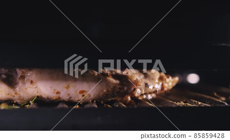Delicious juicy meat steak cooking on the grill. Cook grilling fresh chicken breast. Fry chicken fillet on electric roaster. Slow motion. Delicious juicy meat steak cooking on the grill. Cook grilling fresh chicken breast. Fry chicken fillet on electric roaster. Slow motion. 85859428