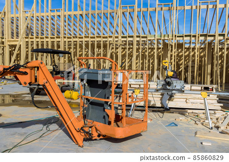 Wood building frame on new residential construction home framing home boom truck forklift in the new home 85860829